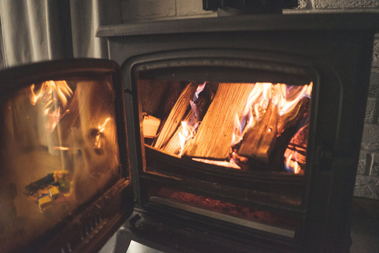 Wood burning inside a wood stove.